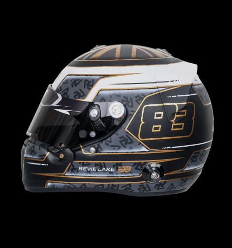 Revie Lake's race helmet, black and grey with gold detailing and the number 83