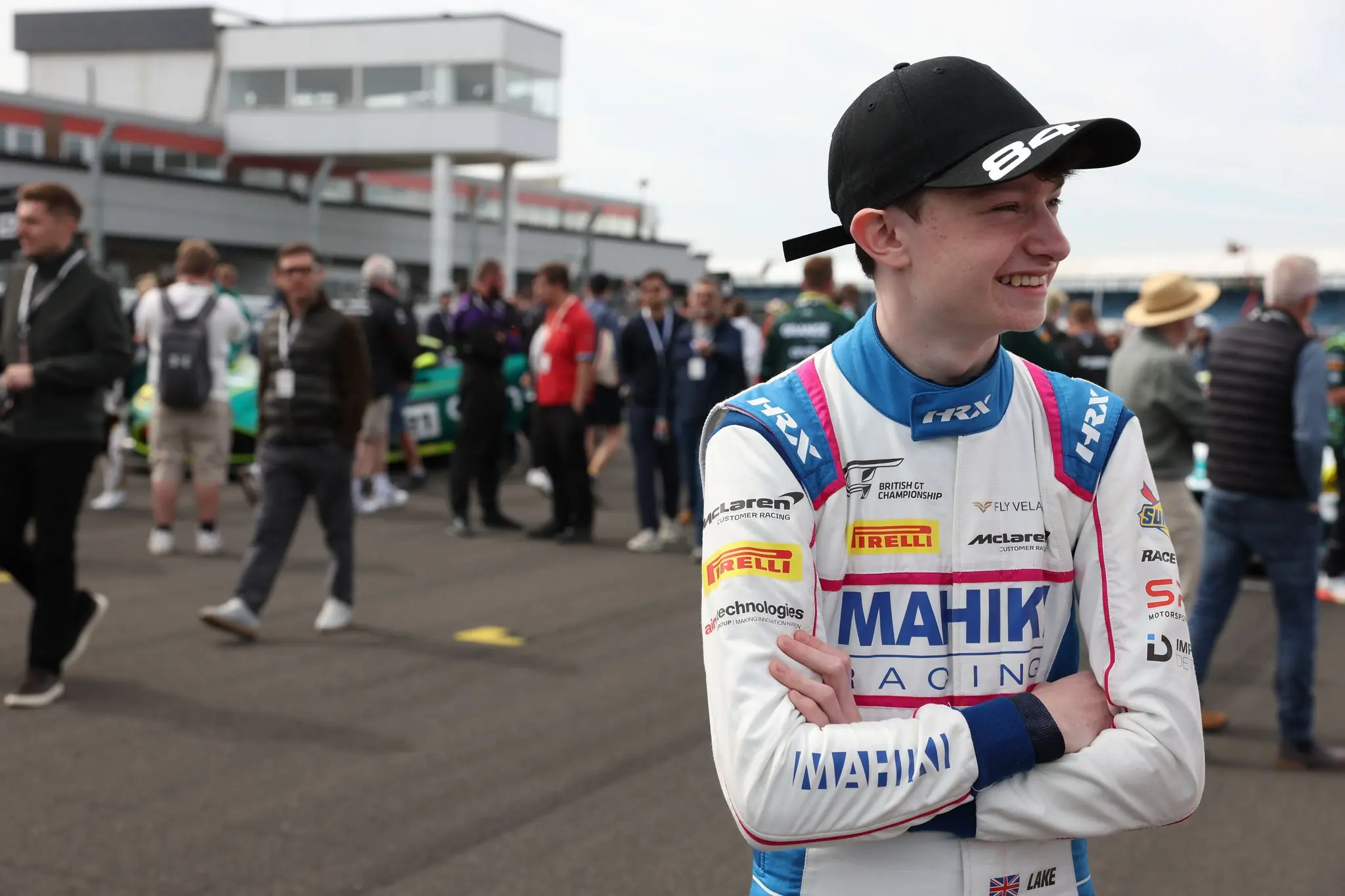 Revie Lake in Mahiki Racing overalls and a number 84 cap on the grid before a British GT race