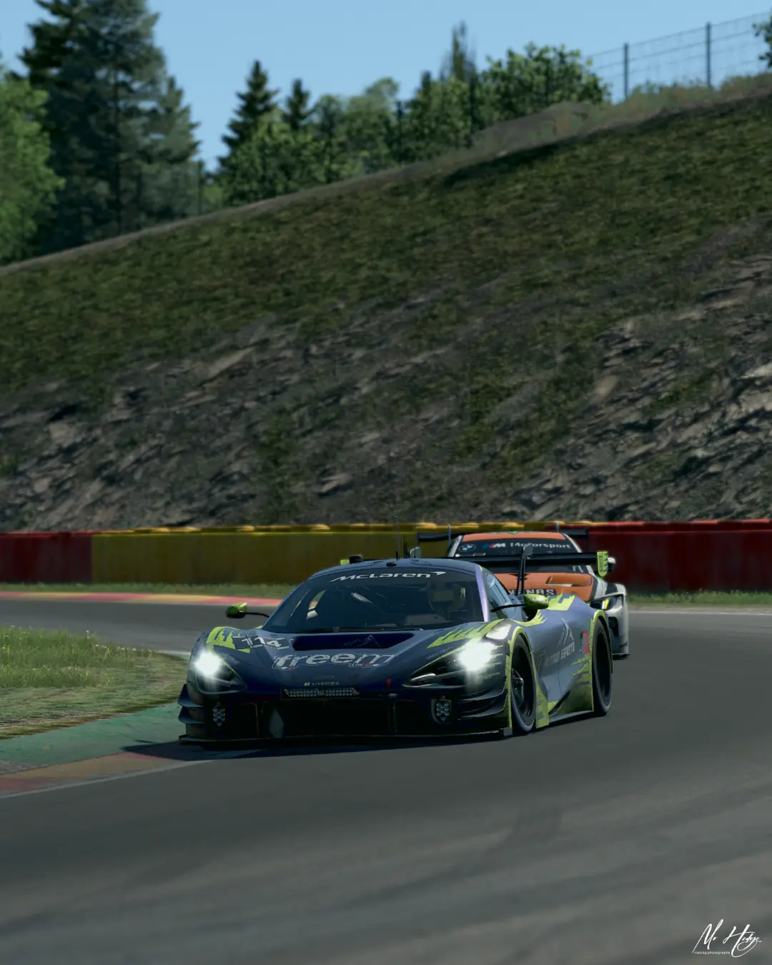 The number 114 Altitude Esports McLaren 720S GT3 holding off a BMW M4 GT3 at Spa-Francorchamps