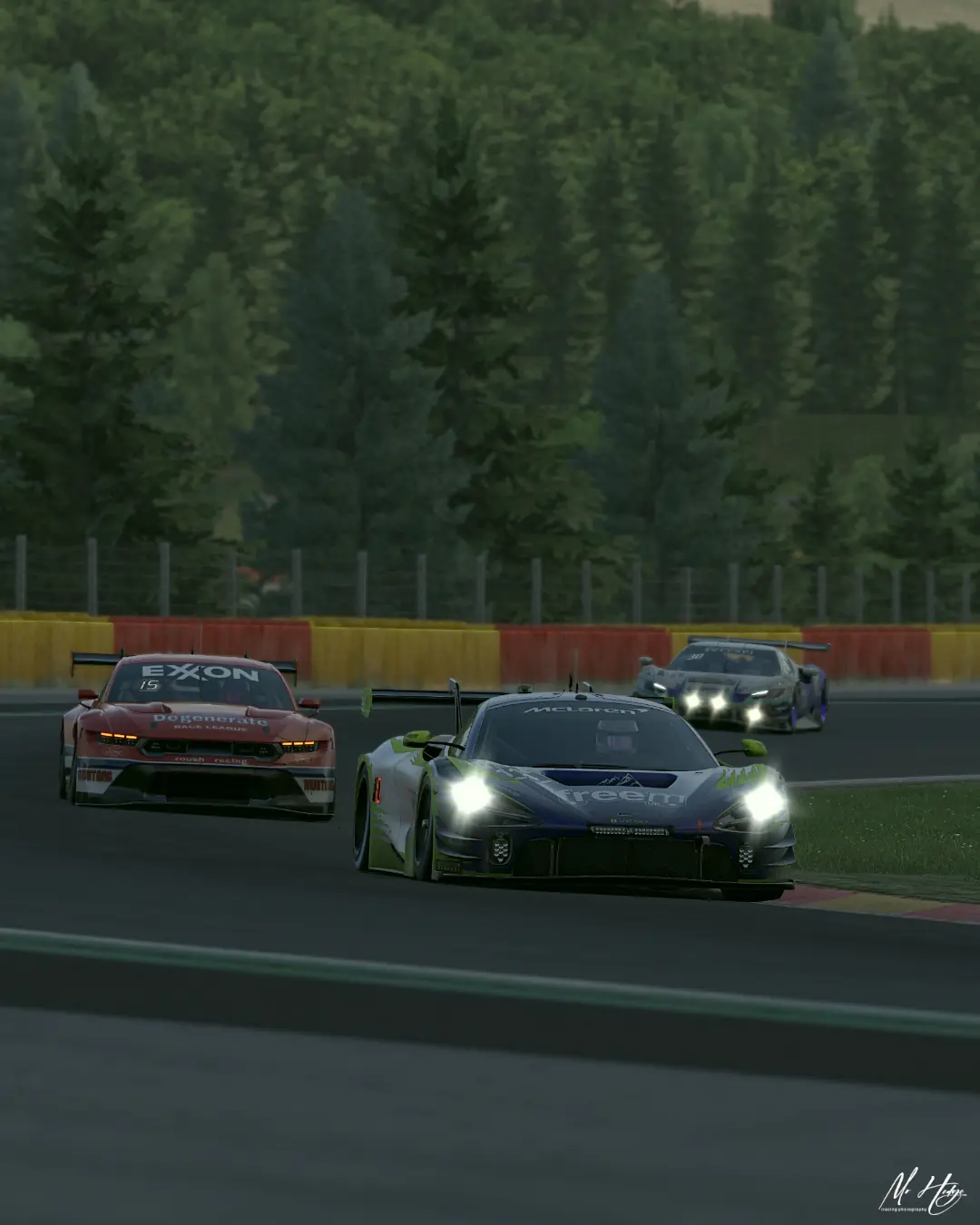 The number 114 Altitude Esports McLaren 720S GT3 leading a Mustang and a Lamborghini at Spa-Francorchamps